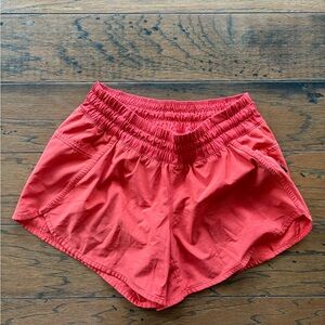 Orange Lululemon running shorts size 6